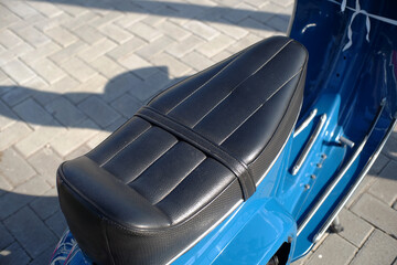 Modified motorcycle seat for this type of scooter that still maintains its classic style.