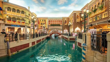 Tourists cruising gondola ship on a canal with architecture building venice style
