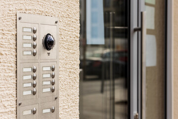 Intercom System, Door Bell buttons with Microphone and Camera. Entrance Door with Modern Intercom of Apartment Building.