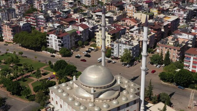White Mosque, Cityscape and Mountains. Antalya, Turkey. Aerial View. Drone Flies Downwards, Tilt Up. Crane Shot