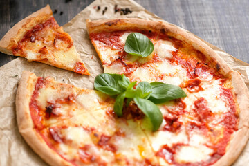 Satisfy Your Cravings: Mouthwatering Pizza Slices on Rustic Wood