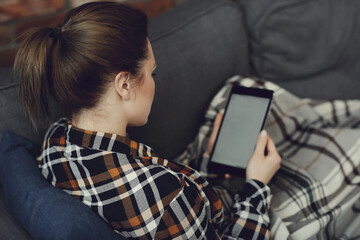 A modern working girl in her cozy home office, effortlessly multitasking while striking poses for...