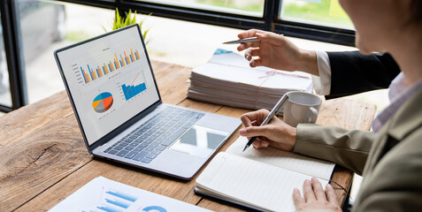 Close up of a group of business people brainstorming describes the list of working together at the office. with new finance project plan during the discussion at the meeting.