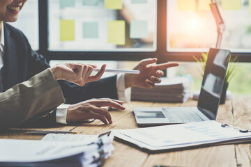 Financial analyst analysis business report on digital tablet during discussion at meeting of corporate showing the results of their successful teamwork., business meeting concept, Marketing...