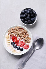 Healthy breakfast set on grey background. The concept of delicious and healthy food.
