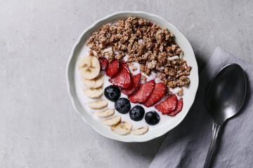 Healthy breakfast set on grey background. The concept of delicious and healthy food.