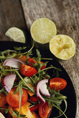 Savor the Flavor: Smoked Chicken and Salad on a Dark Wooden Background, a Perfectly Delicious Combination