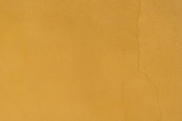 Old yelloew wall with fissure texture abstract background