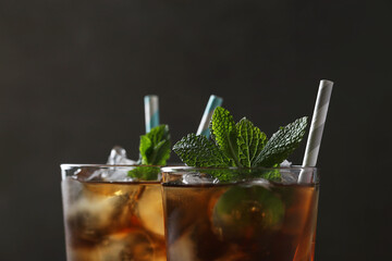 Stay Refreshed: Iced Tea with mint on a Dark Background, the Perfect Beverage to Quench Your Thirst...