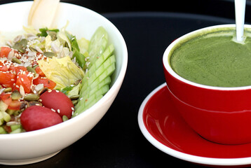 healthy vegan lunch bowl. Avocado, quinoa, tomato, cucumber, red cabbage, green peas and radish vegetables salad.