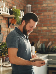 Cooking. Handsome man at kitchen