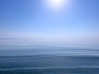 Fototapeta premium Blue sky and calm sea water at sunny day.