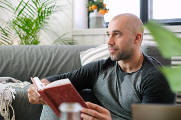 Man at home and read a book