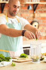 Healthy Habits in the Kitchen: Fitness Man Cooks Up a Delicious and Nutritious Salad and Milkshake