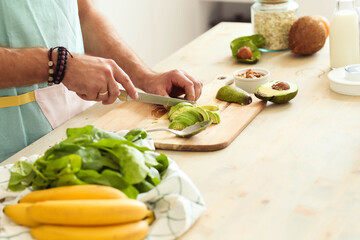 Healthy Habits in the Kitchen: Fitness Man Cooks Up a Delicious and Nutritious Salad and Milkshake
