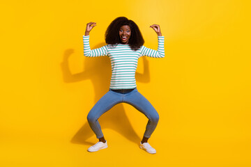Fototapeta na wymiar Full length portrait of positive cheerful person arms fingers demonstrate bla blah gesture isolated on yellow color background