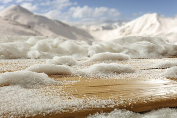 Wooden desk cover of snow and frost and winter landscape. 