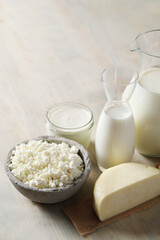 Homemade cooked healthy milk products for breakfast in a wooden bowl on the table and near a bottle of milk. Place for text. Fitness food, snack