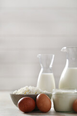 Homemade cooked healthy milk products for breakfast in a wooden bowl on the table and near a bottle of milk. Place for text. Fitness food, snack