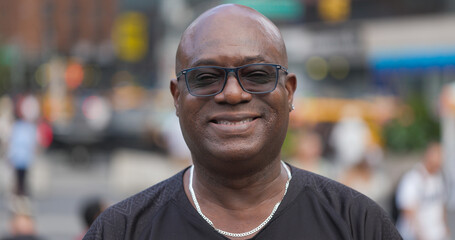 Mature black man smile happy face portrait on a city street