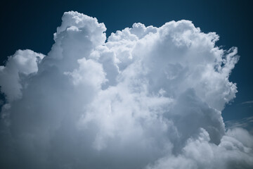 Ariel view of cumulus cloud spreading in the sky