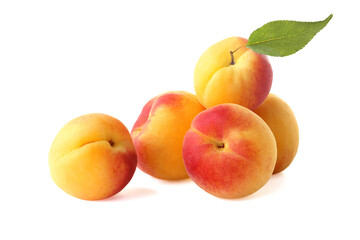Ripe tasty apricots with leaf isolated on white