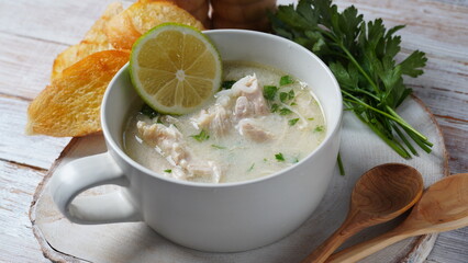 Avgolemono - traditional greek chicken soup with rice, lemon and eggs
