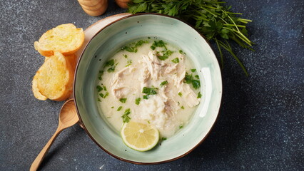 Avgolemono - traditional greek chicken soup with rice, lemon and eggs