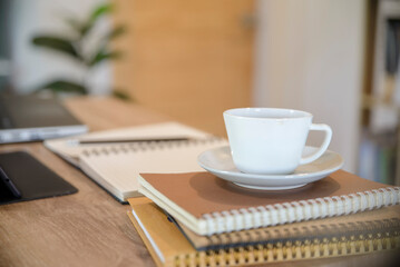 Desk for student education concept. Stationery, Book, tablet, and pencil for study for exam placed on wooden School table for student plan to work at home.