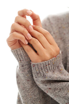 Beautiful women&rsquo;s hands with groomed nails on a light background