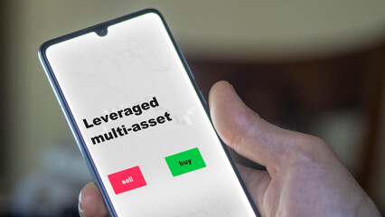 An investor's analyzing the leveraged multi-asset etf fund on screen. A phone shows the ETF's prices leverage multi-asset to invest