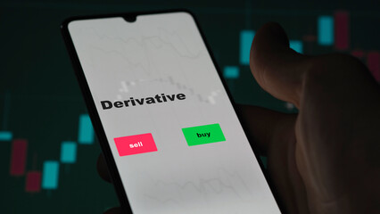 An investor's analyzing the derivative etf fund on screen. A phone shows the ETF's prices derivative to invest