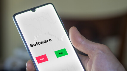 An investor's analyzing the software etf fund on screen. A phone shows the ETF's prices digital cloud to invest