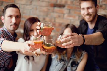 The company of friends have fun together drinking drinks
