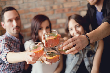 The company of friends have fun together drinking drinks
