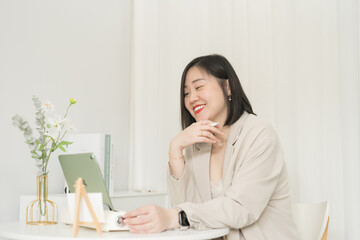 asian business and writer woman smile and happy during think new idea and meeting online