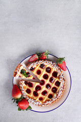 Obraz na płótnie Canvas Top view of fresh tasty homemade pie with berries on the plate