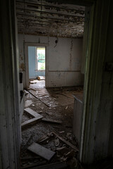 Fototapeta na wymiar A badly damaged abandoned house interior