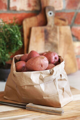 A bag of fresh raw potatoes in the kitchen