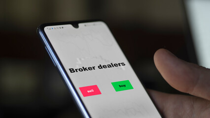 An investor's analyzing the stocks on screen. A phone shows the ETF's prices broker dealers