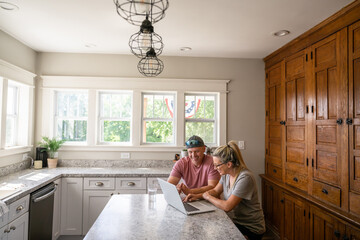 Marine veteran at home with family on a early morning in the kitchen.