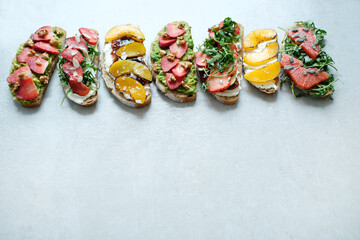 A range of delicious fresh Bruschetta (sandwiches) with different tastes on a white background