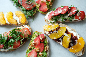 Close view of delicious fresh Bruschetta (sandwiches) with different tastes on a white background
