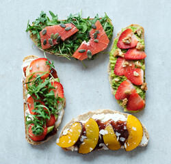 Close view of delicious fresh Bruschetta (sandwiches) with different tastes on a white background