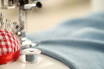 Sewing machine with fabric and thread