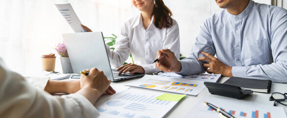 business people meeting in the office Calculate the tax and income of the company's investment. Strategic Planning and Brainstorming colleague concept, report, analyze graph plans