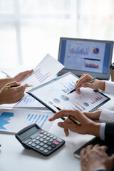 business people meeting in the office Calculate the tax and income of the company's investment. Strategic Planning and Brainstorming colleague concept, report, analyze graph plans