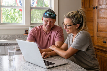 Marine veteran at home with family on a early morning in the kitchen.
