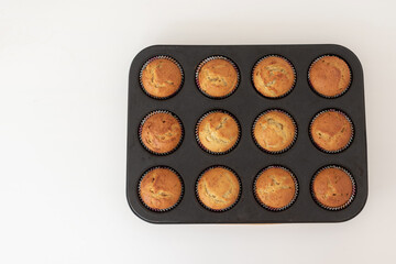 The process of making homemade cupcakes, top view. Prepared muffins in the form. Step five