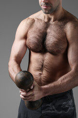 Men’s strong hands holding heavy metal weights 